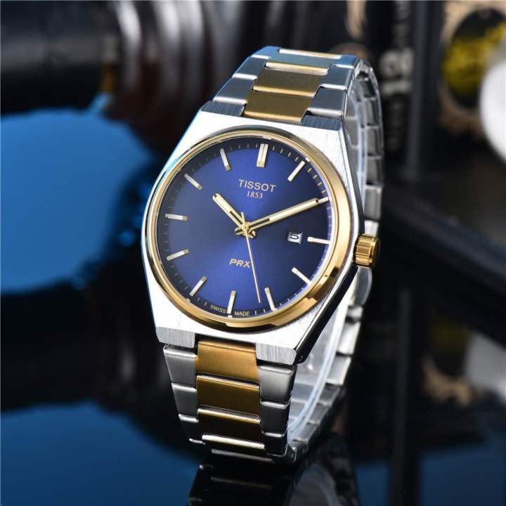 ساعة Tissot PRX Two-Tone Watch – Green / Blue Dial with Date مطعم لون ميناء اخضر ولزرق 